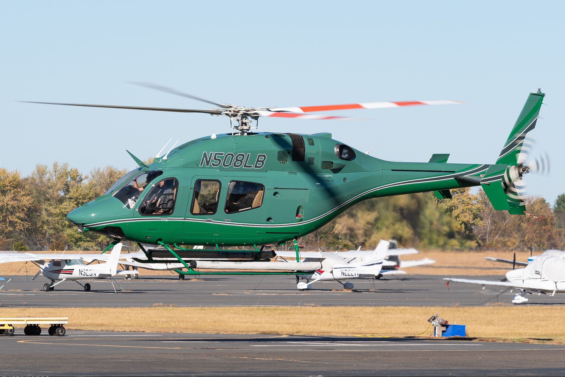 The helicopter previously N508LB, with green paint.