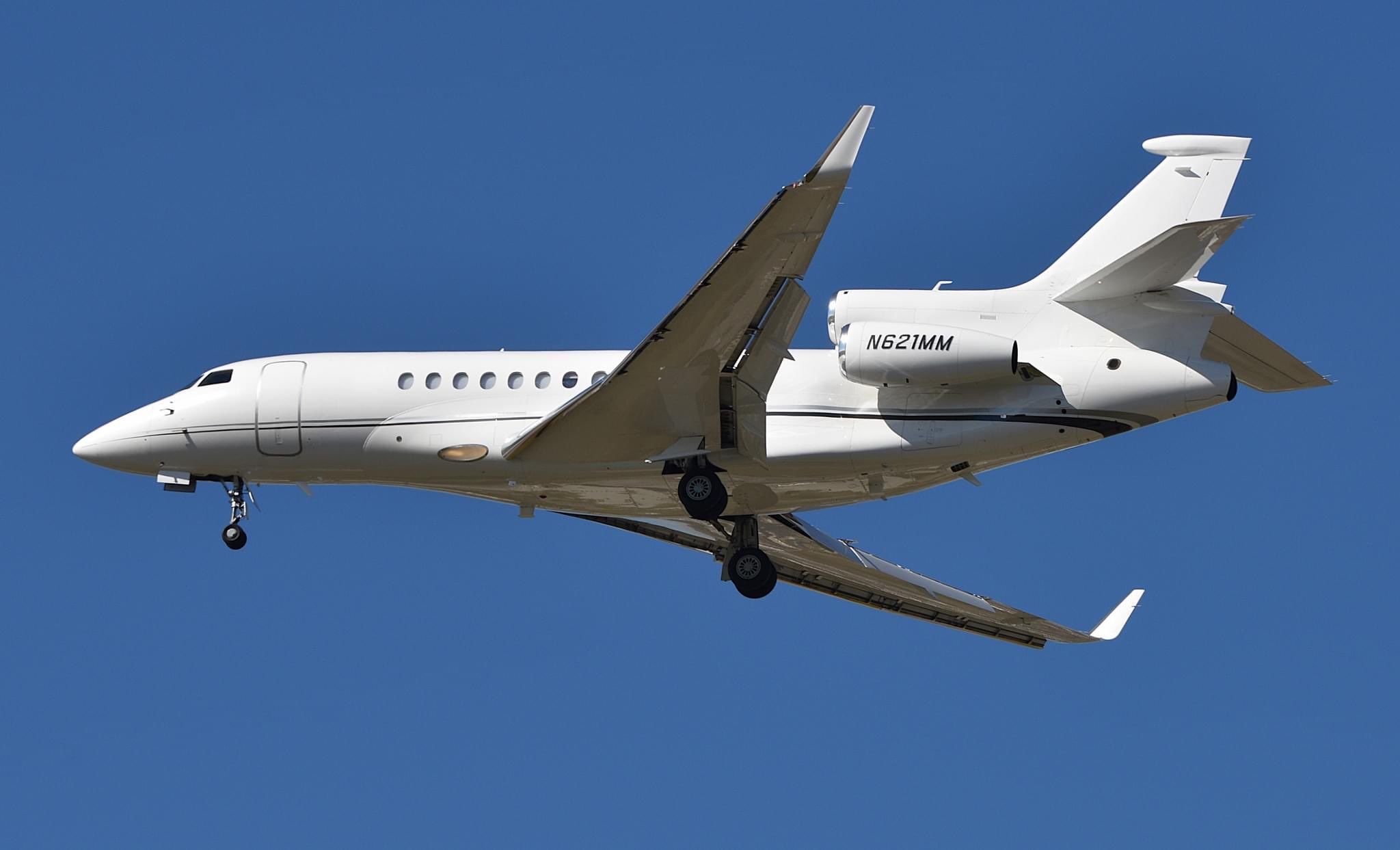 N621MM seen with horizontal cheatline bands paint scheme.